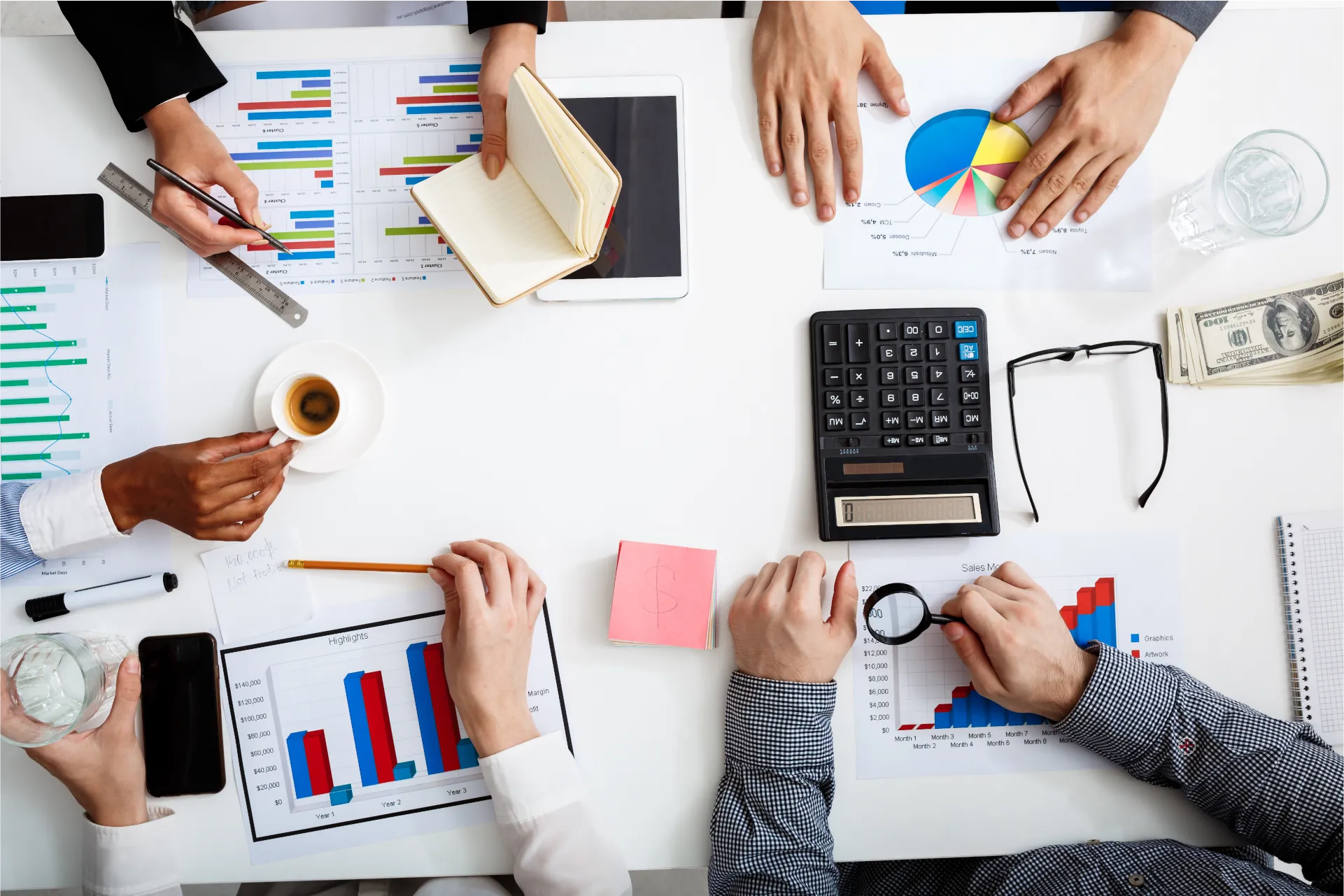 Professional financial planning desk with organized documents, calculator, and financial planning tools